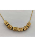 B Gold necklace Chanel